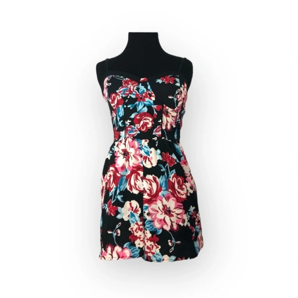 Band of Gypsies shorts romper black background with floral pattern
